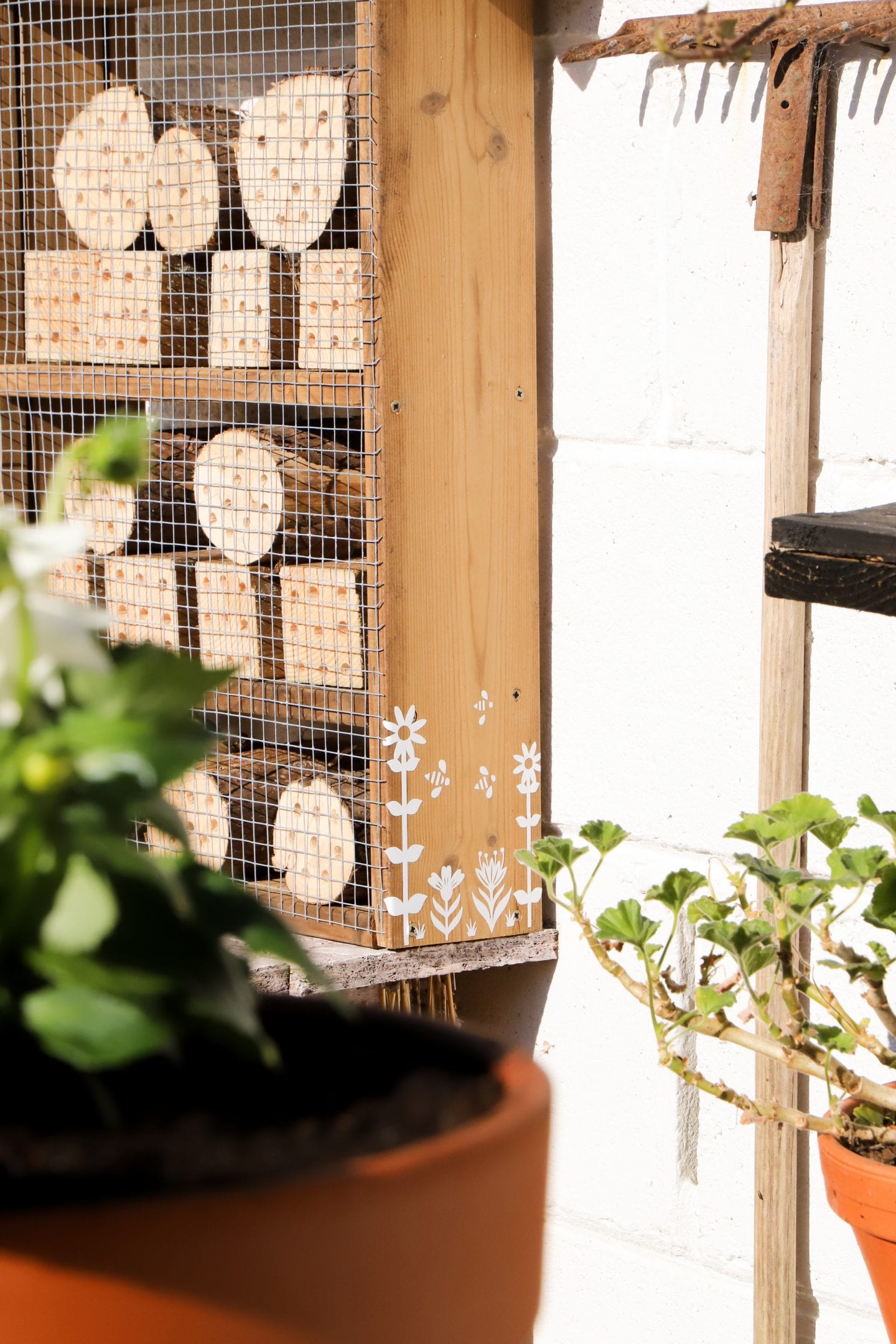 DIY bee house, decorated using the cricut machine.
