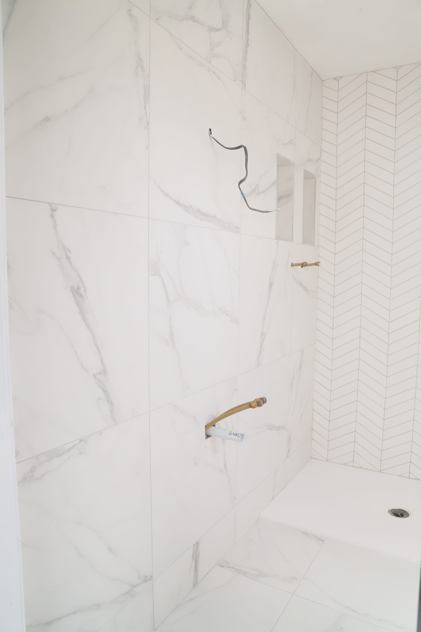 Chevron and marble tiles.