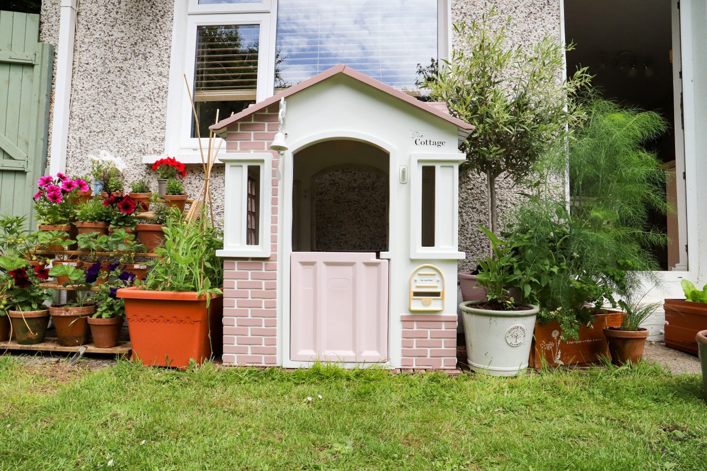 Painted plastic playhouse, girly makeover.