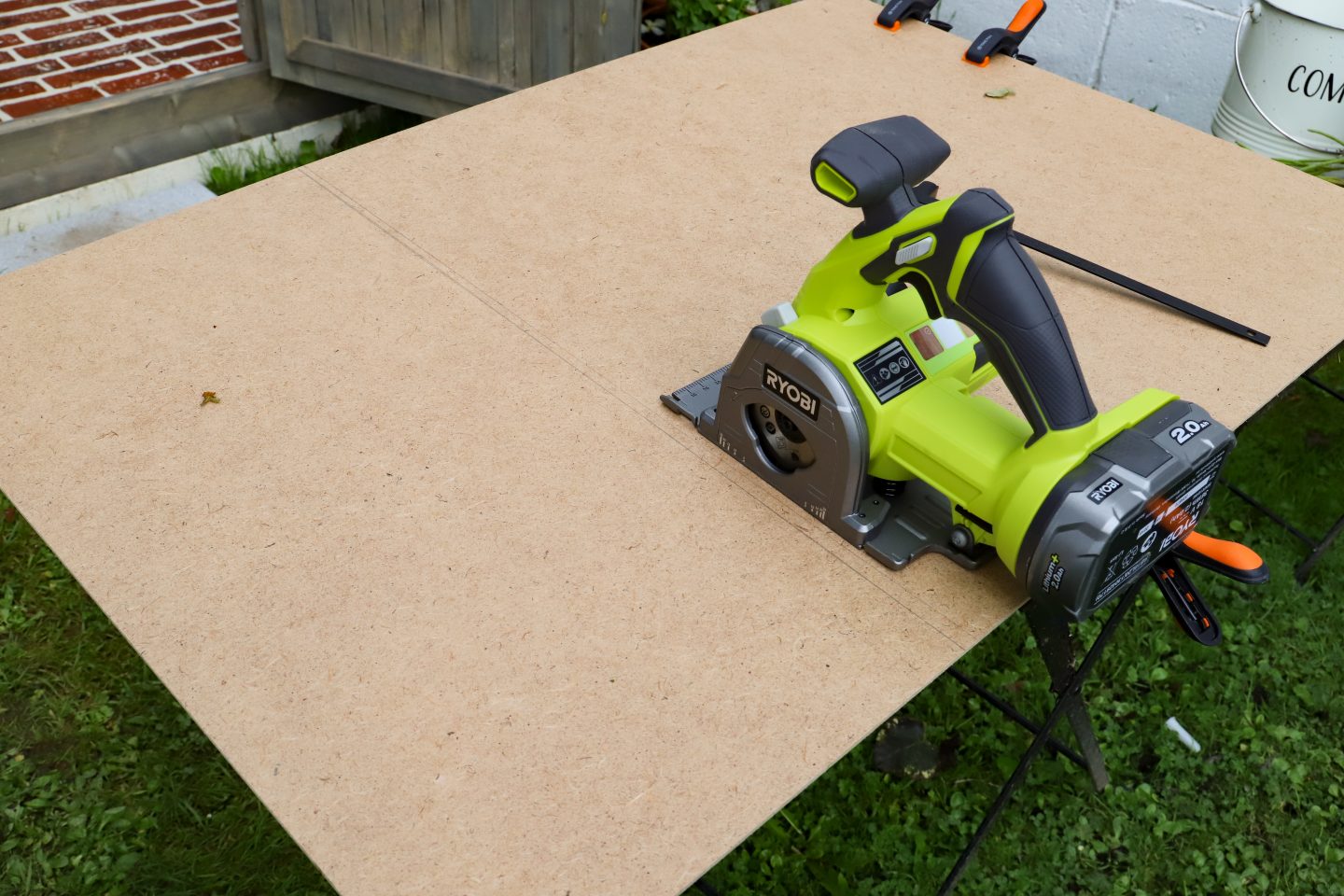 Cutting a sheet of MDF with Ryobi multi media circular saw tool.