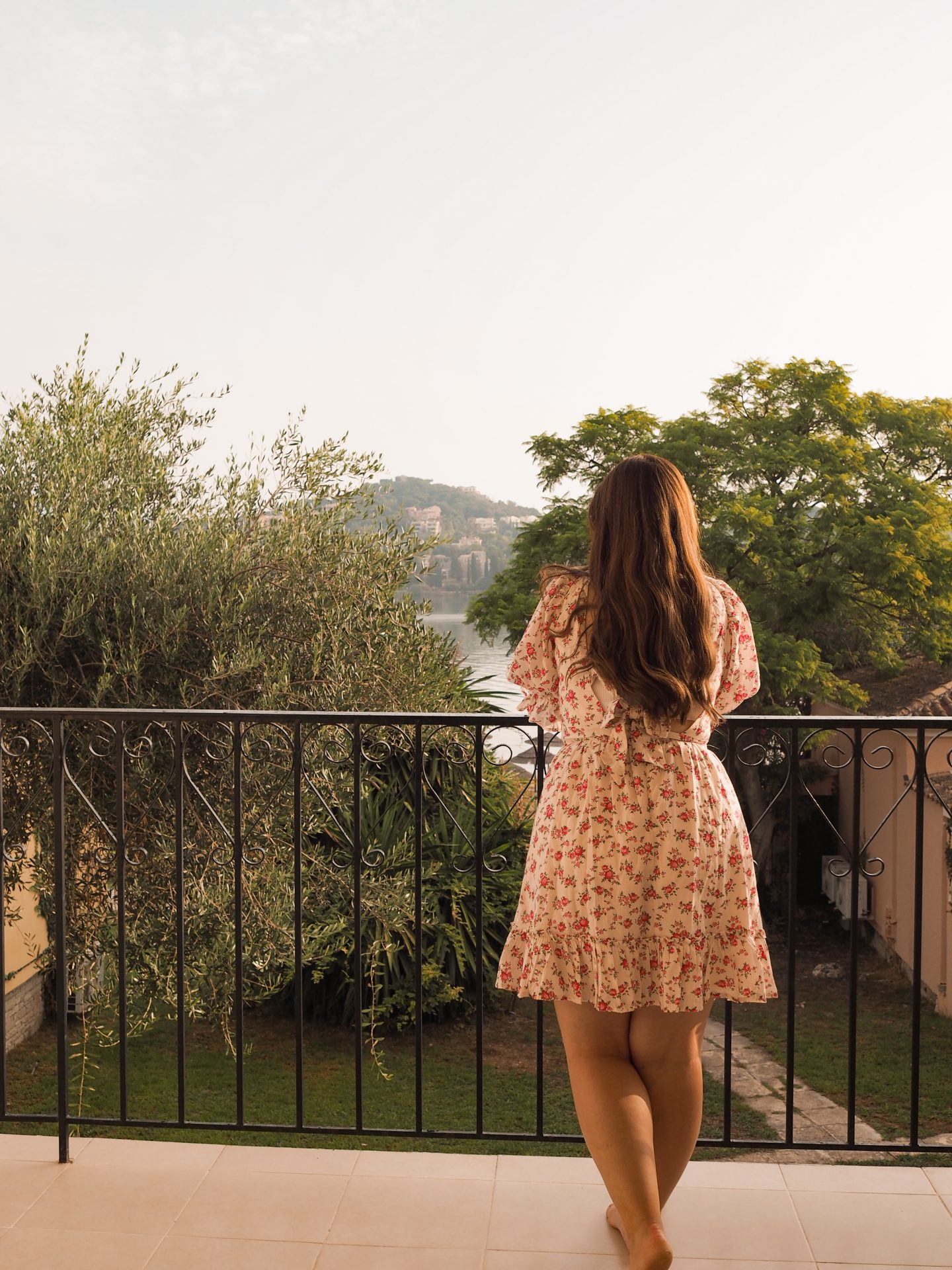 Girl on balcony in Corfu. 