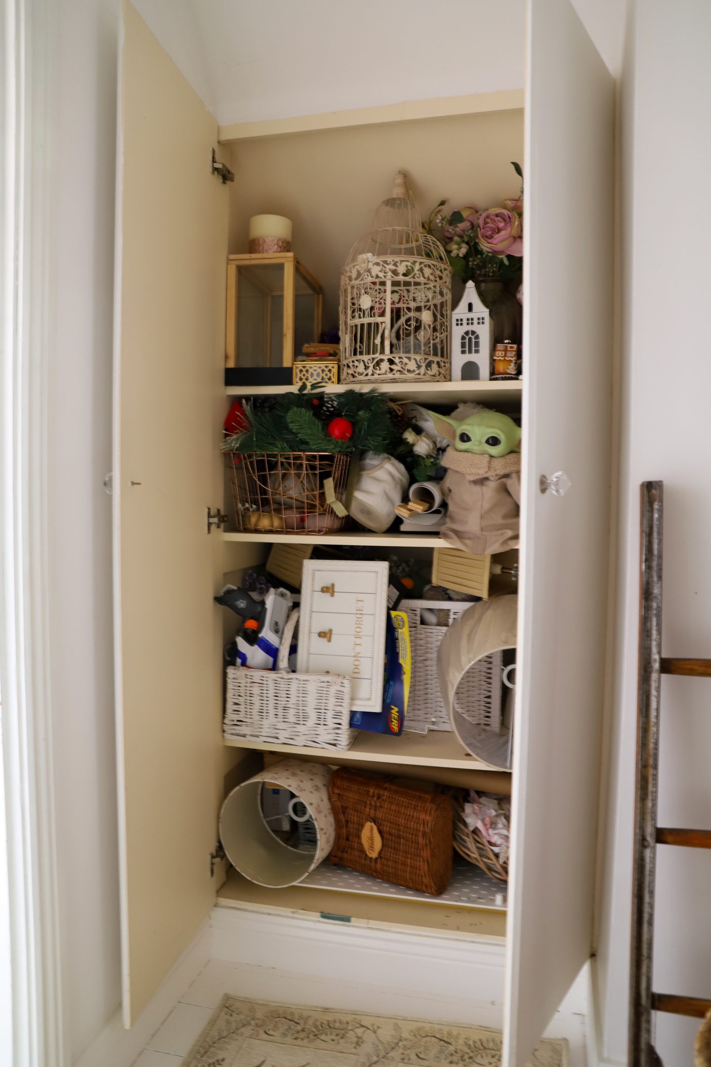 Cluttered cupboard.